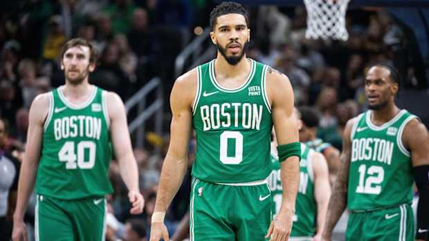 Jayson Tatum walks down the court.
